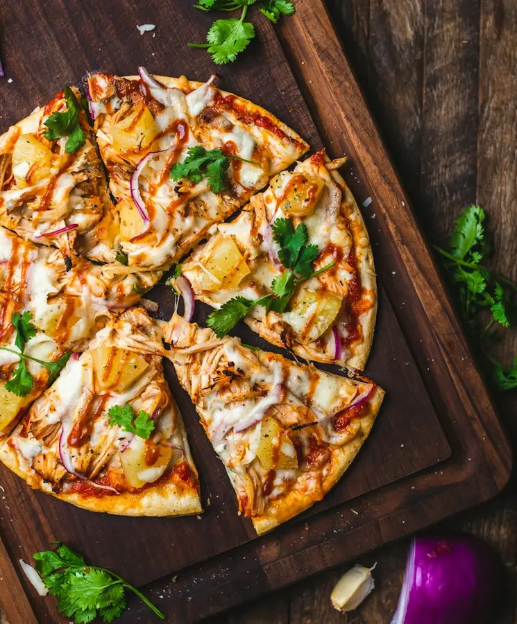 A fresh-baked pizza topped with basil